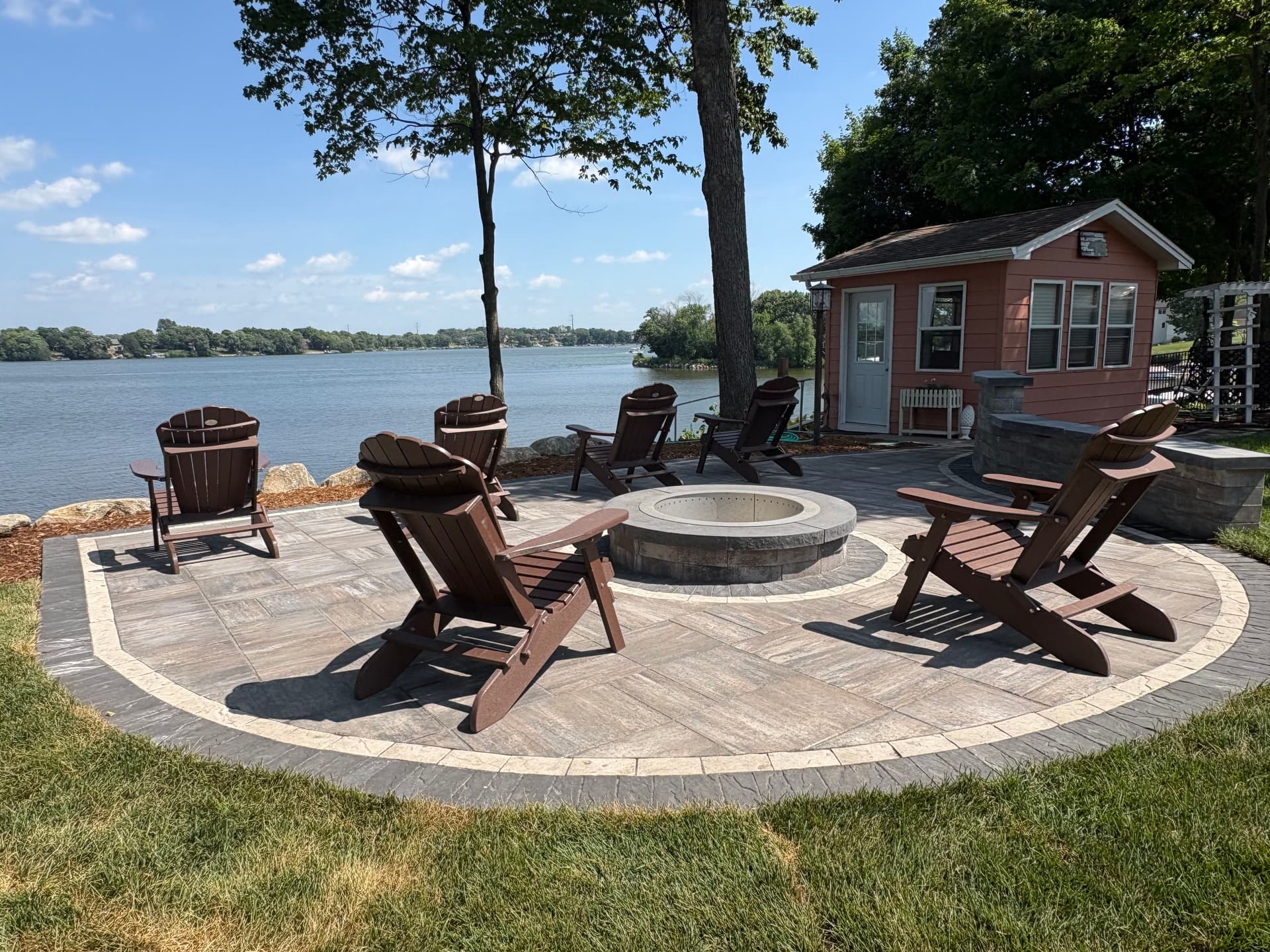 Cedar Lake Patio and Firepit Build with Boulder Wall image