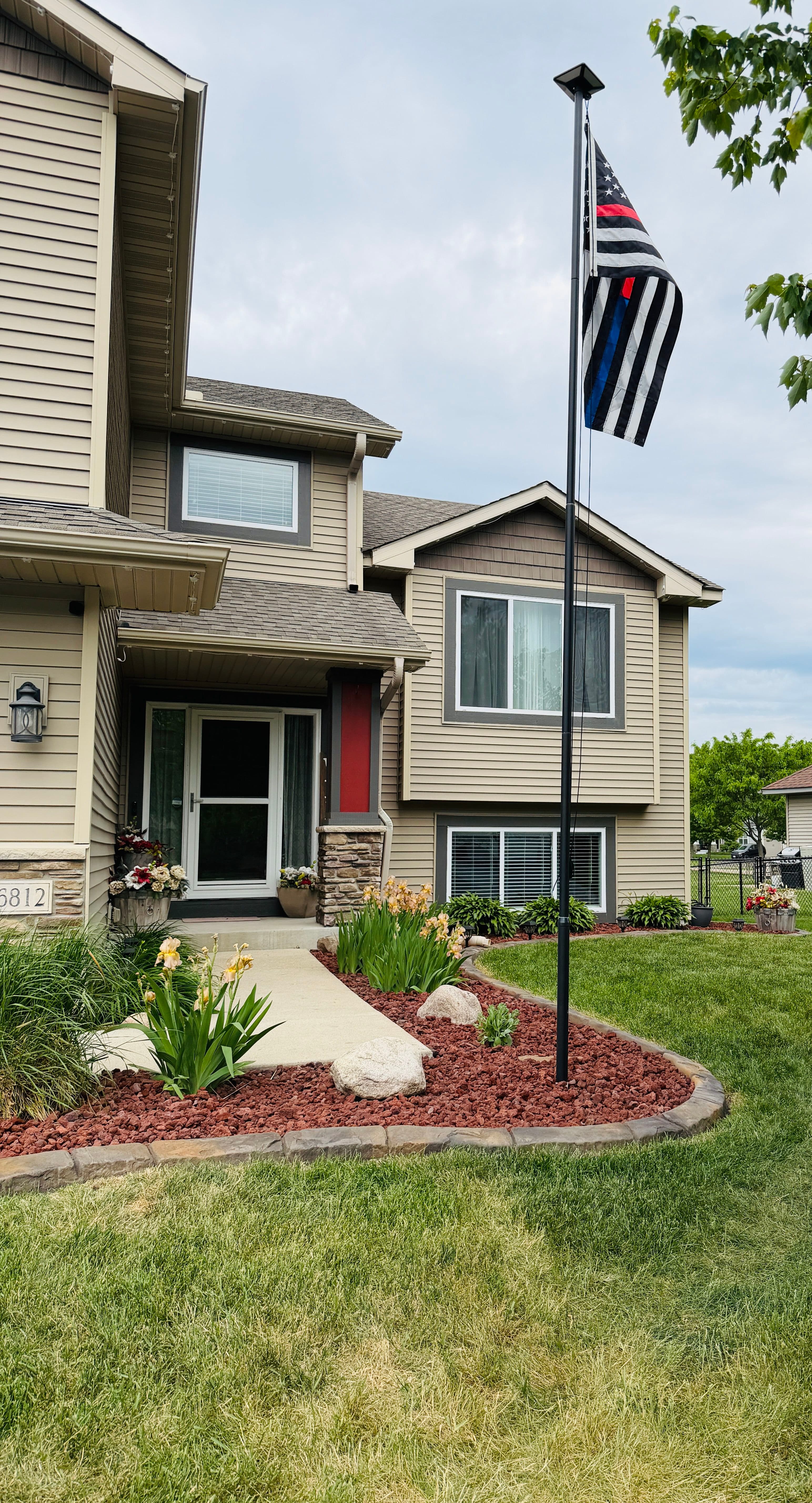 Project Landscape Curbing, Rock, and Plants Give This Yard a Sharp New Look image