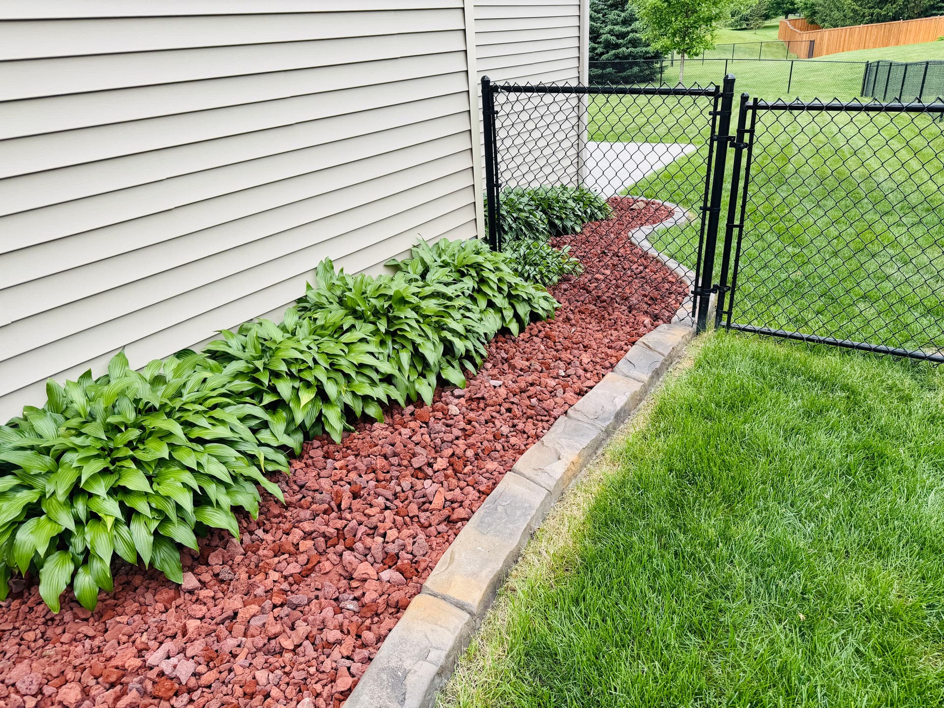 Gallery photos for Landscape Curbing, Rock, and Plants Give This Yard a Sharp New Look: Image #1