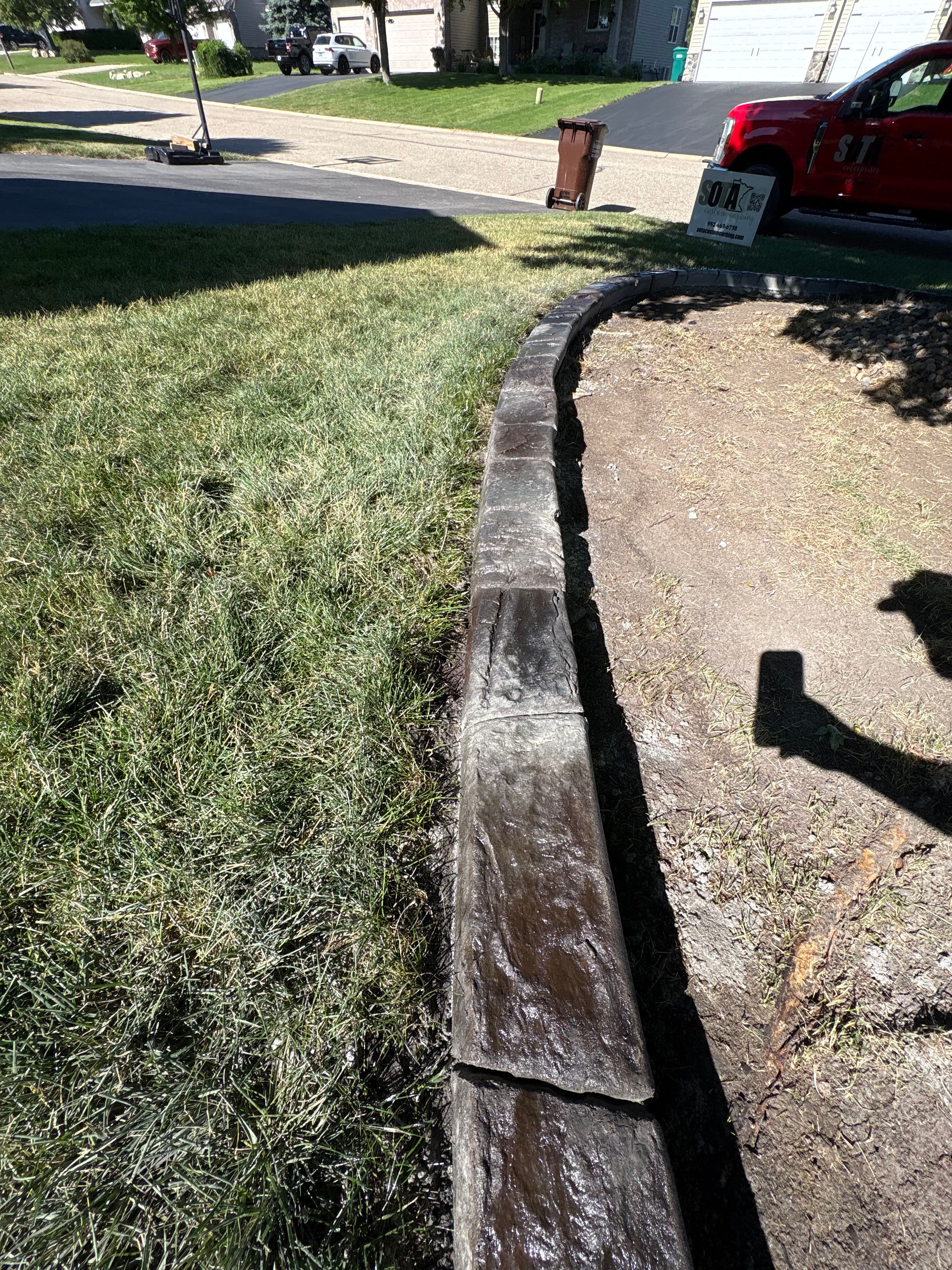 Project Concrete Curbing That Keeps Landscape Beds Defined for Good image
