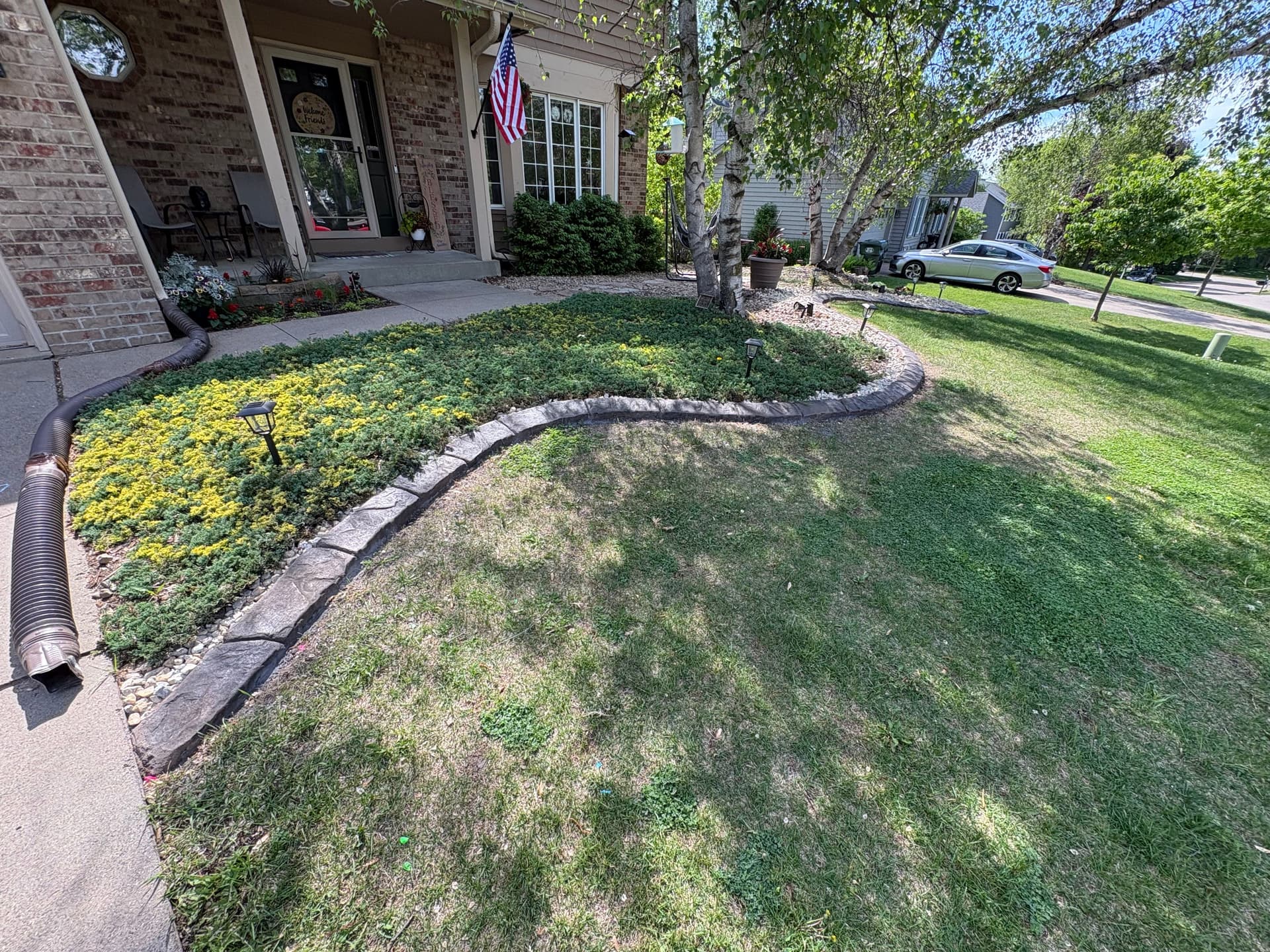 Concrete Curbing and Rock Beds That Actually Stay Put image