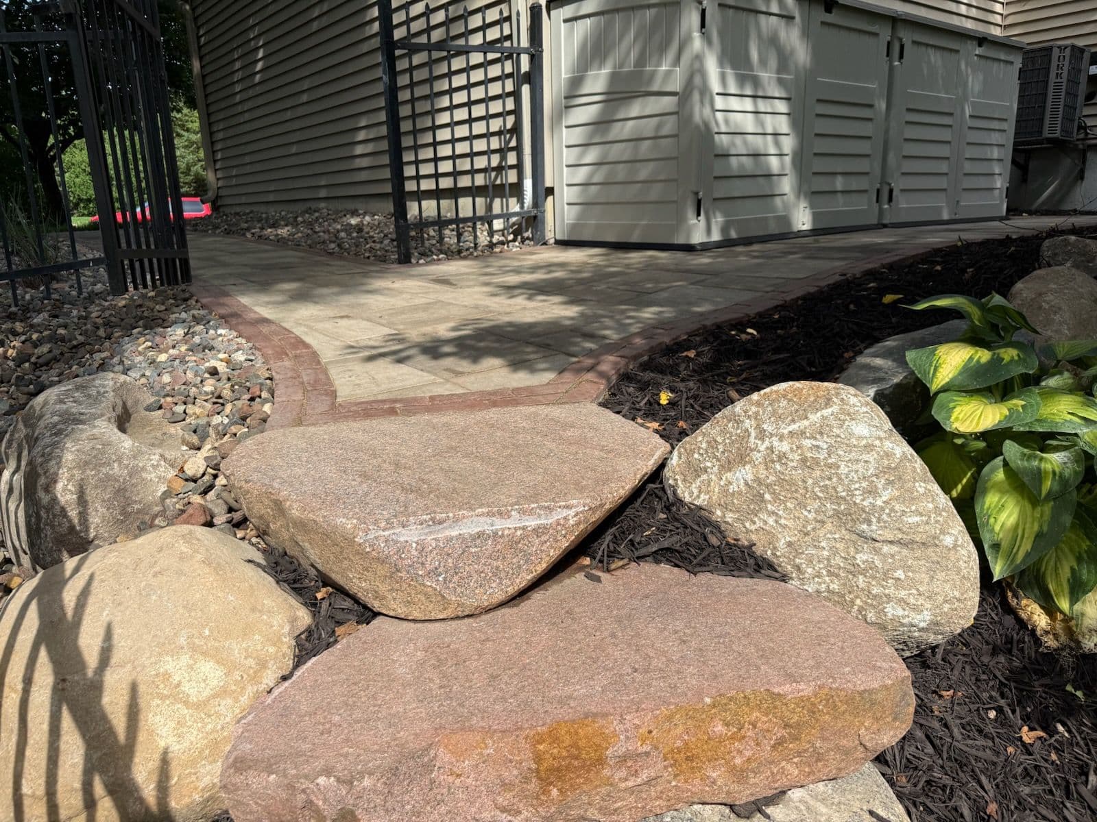 Stunning Boulder Walls and Paver Sidewalk in Lakeville image