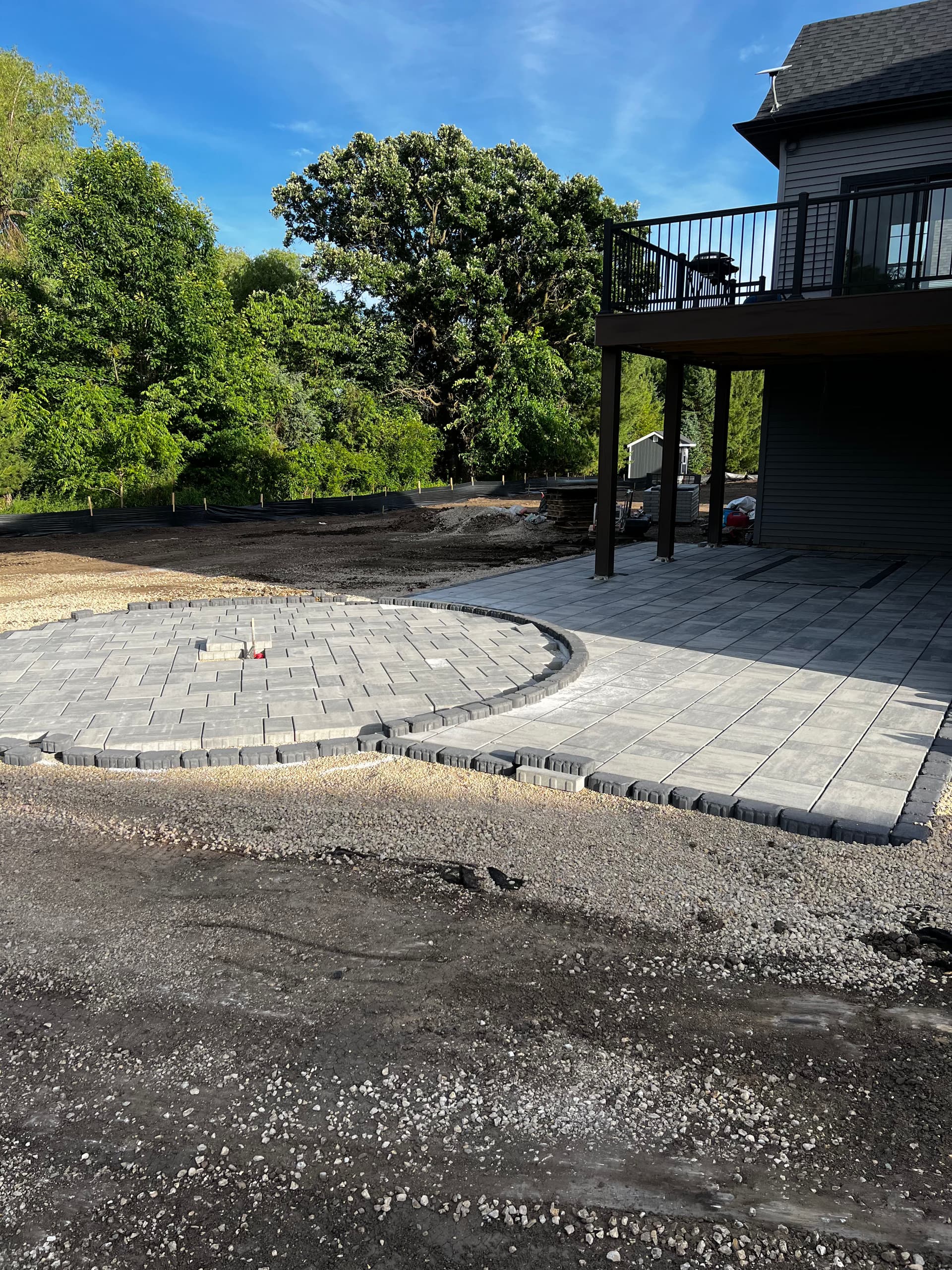 Custom Paver Patio Build With a Curved Fire Pit Area image